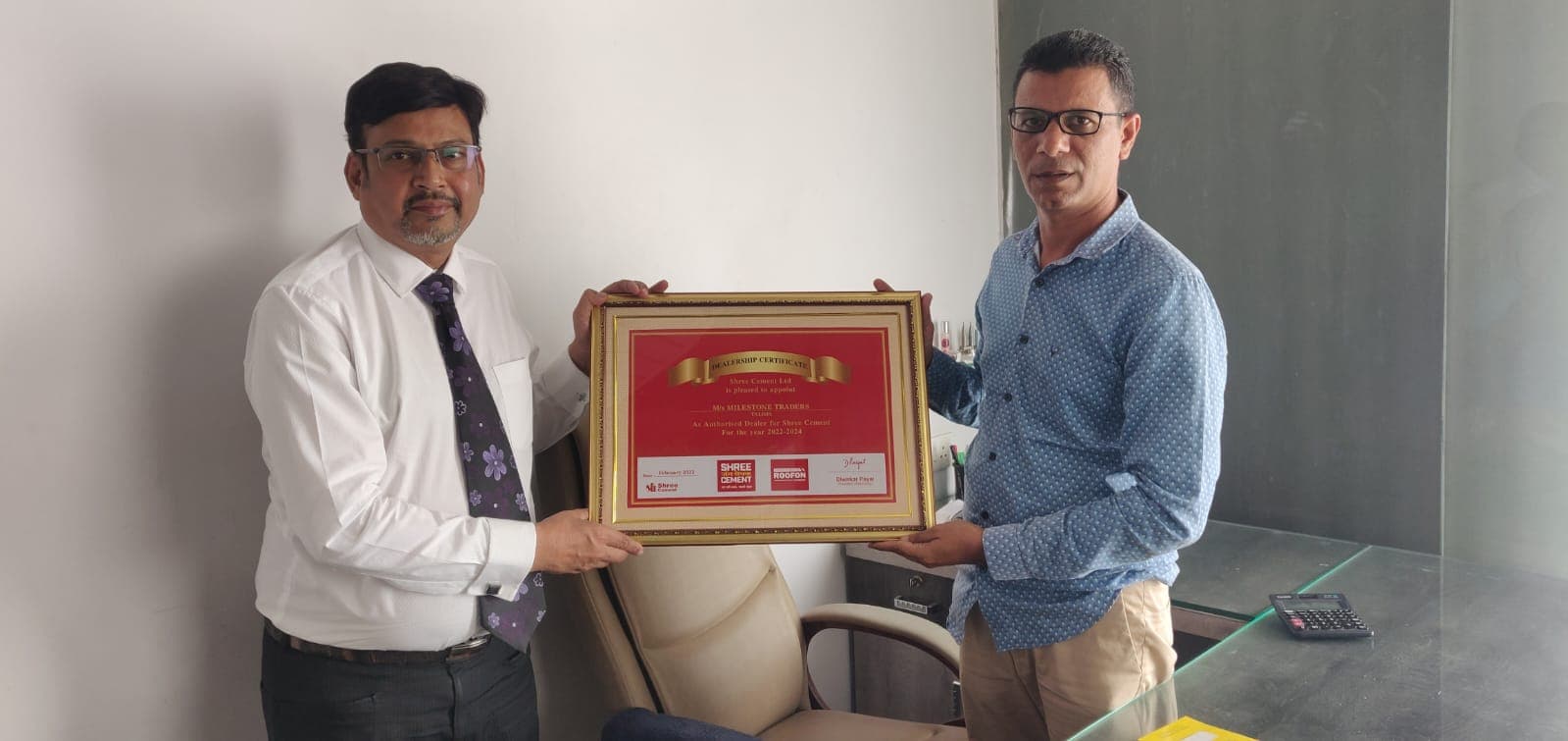 Handing over the Shree Cement dealership certificate to Milestone Traders