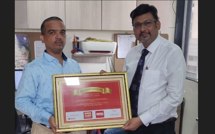 Handing over the Shree Cement dealership certificate to Shri Padmavati Enterprises