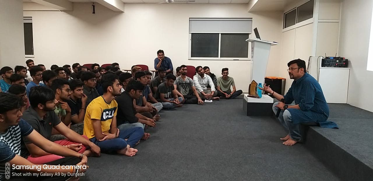 Ashay Shah leading a training session with a large group of students